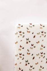 Clementine Kids butterfly pattern close-up showing breathable muslin for cozy naps