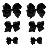 Clipband Black Bows 6-pack packaging showcases vibrant variety and ready-to-wear accessories.