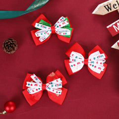 Clipband Christmas hair bow green snowflake detail for cute winter outfits.