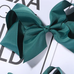 Clipband Hunter Green Bows close-up shows handmade grosgrain ribbons and durable clips.