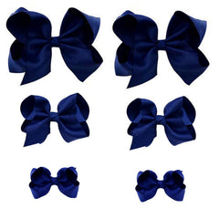 Clipband Navy Bows closeup highlights durable grosgrain texture for everyday style.