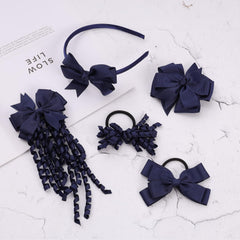 Clipband navy pom-pom hair ties add playful accents and secure holds.