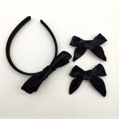 Clipband two-bow set worn with ponytail, bun, or braid.