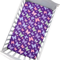Cloele butterfly pattern on fitted sheet creates cheerful nursery aesthetics and gentle sleep ambience.