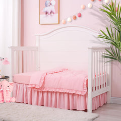 Cloele quilted comforter pink 33x42 with a 2-inch ruffle for cuddly warmth.