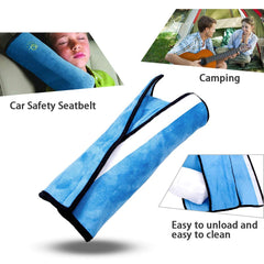 coffled blue seatbelt pillow edge view highlighting compact travel size.