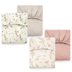 ColoBrethy crib sheet apricot pink floral close-up showing a gentle print for nursery charm.