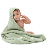 Comfy Cubs hooded towel laid flat, showcasing its plush 6-layer muslin for quick drying.