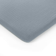 Comfy Cubs muslin bassinet sheet unfolded, breathable cotton for baby sleep comfort.