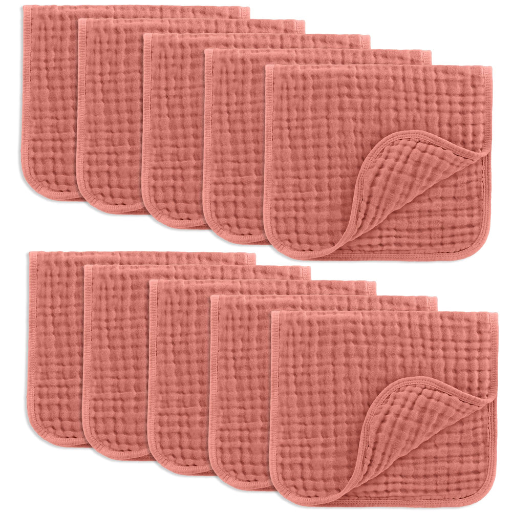 Comfy Cubs Muslin Burp Cloths folded in dusty rose provide gentle care