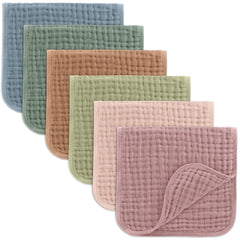 Comfy Cubs muslin burp cloths folded, soft and breathable for baby.