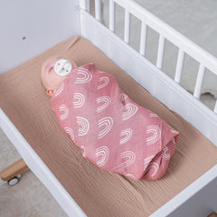 Comfy Cubs muslin swaddle blanket closeup showing breathable fabric for baby skin.