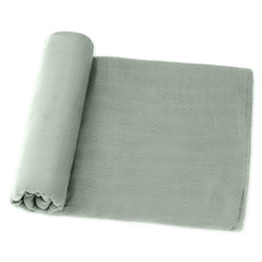 Comfy Cubs muslin swaddle blanket Fern close-up shows soft cotton texture