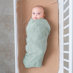 Comfy Cubs muslin swaddle blanket Fern folded neatly for storage