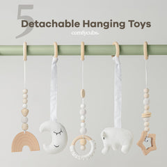 Comfy Cubs play gym five toys closeup showcases sensory hanging toys.