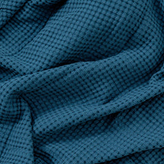 Comfy Cubs waffle blanket ideal for travel and crib use during outings with baby.