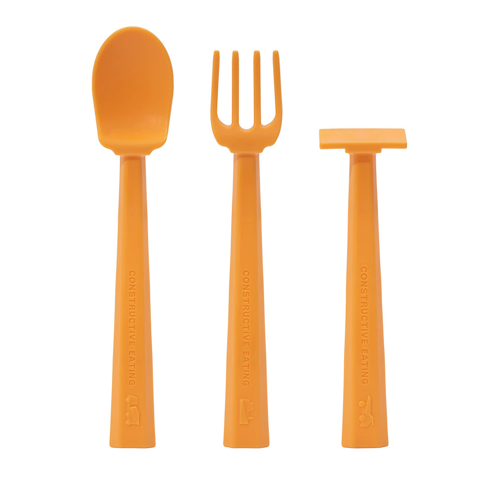 Constructive Eating training spoon with hard-hat orange design supports independent feeding.