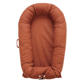 CooCooBaby Deluxe Lounger cocoon close-up shows snug comfort for newborns