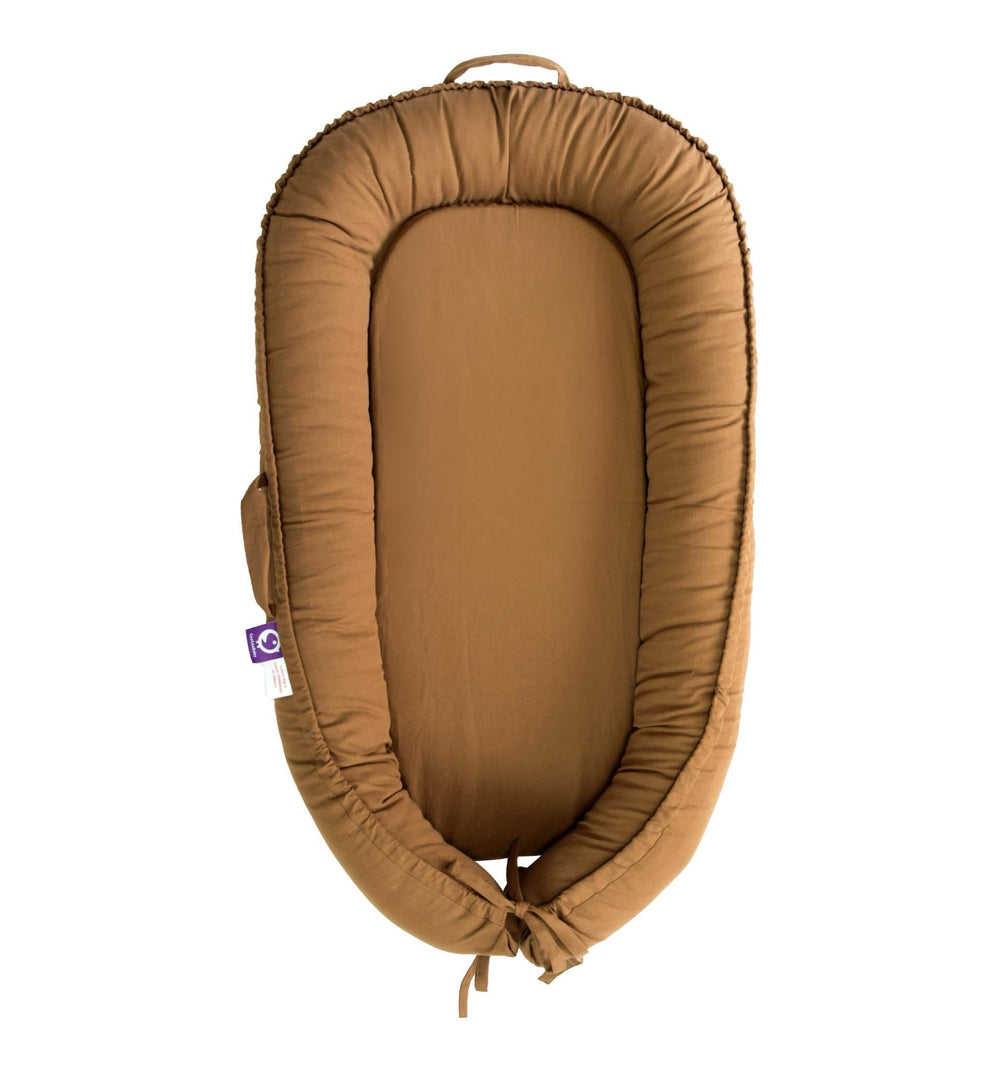CooCooBaby infant lounger brown cotton cover close-up showing breathable fabric for cozy sessions.