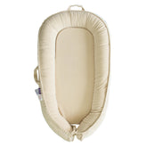 CooCooBaby infant lounger cream white closeup shows plush comfort for newborns.