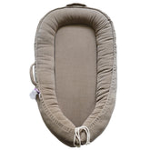 CooCooBaby infant lounger Fields of Rye corduroy - breathable cuddling comfort for soothing moments.