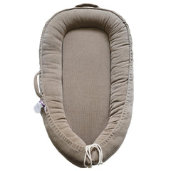 CooCooBaby infant lounger Fields of Rye corduroy - breathable cuddling comfort for soothing moments.