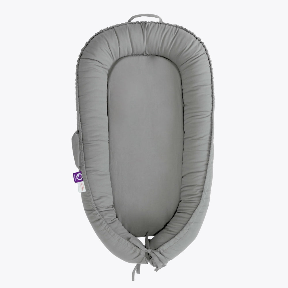 CooCooBaby infant lounger front view showing cozy cuddling support