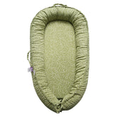 CooCooBaby infant lounger in Green Wonder cover offers cradle-like support during play.