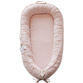 CooCooBaby infant lounger closeup in Mistyrose Corduroy for breathable cuddly comfort