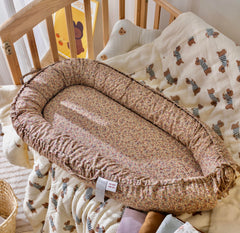 CooCooBaby infant lounger close-up shows breathable cotton texture for comfy naps.