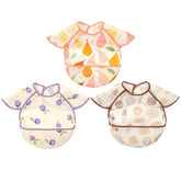 CoolaPeach feeding bibs 3-pack waterproof close-up shows durable fabric protecting outfits during meals