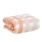 CoolaPeach six-layer gauze swaddle blanket demonstrates airy structure for breathable warmth.