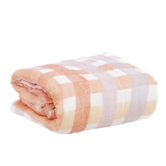 CoolaPeach six-layer gauze swaddle blanket demonstrates airy structure for breathable warmth.