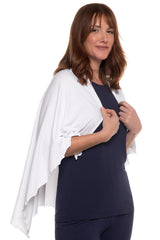 Coolibar Sun Blanket folded in bag showing compact travel-friendly design.