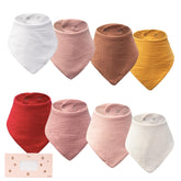 COOROBIN baby bibs flatlay showing eight neutral muslin bibs for easy styling