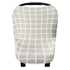 Copper Pearl 5-in-1 car-seat cover in use as a shield for parents on the go.