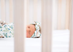 Copper Pearl bow headband nursery-style look with compatible baby outfits.