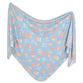 Copper Pearl Clementine swaddle knit closeup highlighting soft stretch for soothing newborn snugness.