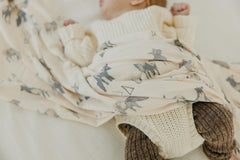 Copper Pearl Cody swaddle doubles as stroller shield on outings.