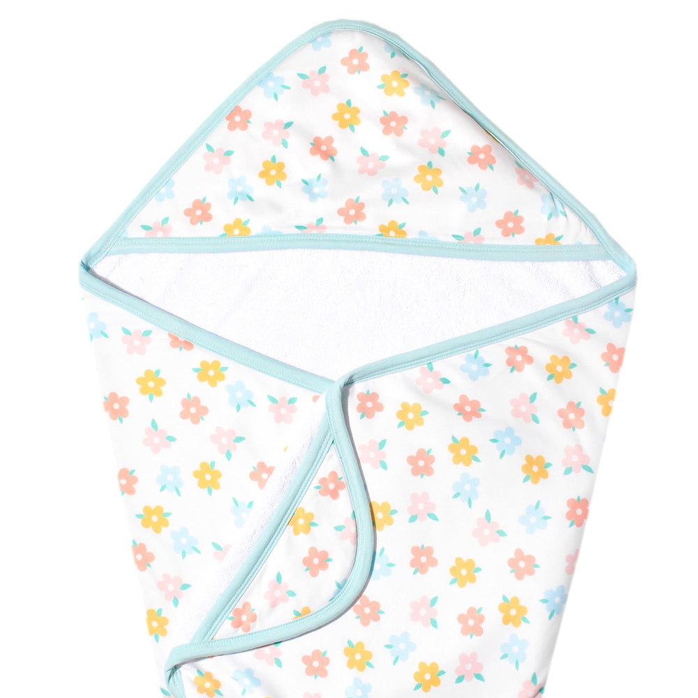Copper Pearl Daisy hooded towel for newborns with warm, absorbent hug after bath.