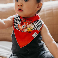 Copper Pearl Disney Pixar Cars bandana bib on baby demonstrating drool absorption