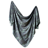 Copper Pearl Hunter swaddle blanket close-up shows soft knit fabric for gentle newborn comfort.