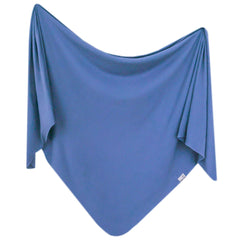 Copper Pearl Indigo swaddle blanket 46in on bed showing size and cozy warmth