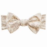 Copper Pearl Jurassic Park Fossils headband shown on a newborn for everyday wear