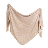 Copper Pearl swaddle sandy closeup soft texture for cozy newborn cuddles.