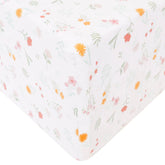 Copper Pearl Mabel crib sheet folded to show premium knit fabric and soft texture.