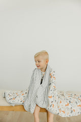 Copper Pearl Rufus newborn swaddle use with soft breathable layers.