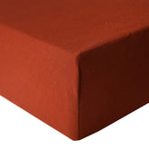 Copper Pearl rust crib sheet closeup shows soft knit fabric for cozy sleep