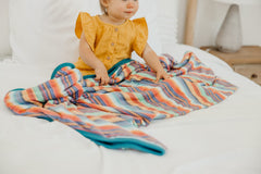 Copper Pearl three-layer blanket in modern nursery pattern, breathable design for all-day coziness.
