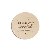 The Cotton and Canvas Co. Hello World disc full shot — timeless newborn keepsake for photos.